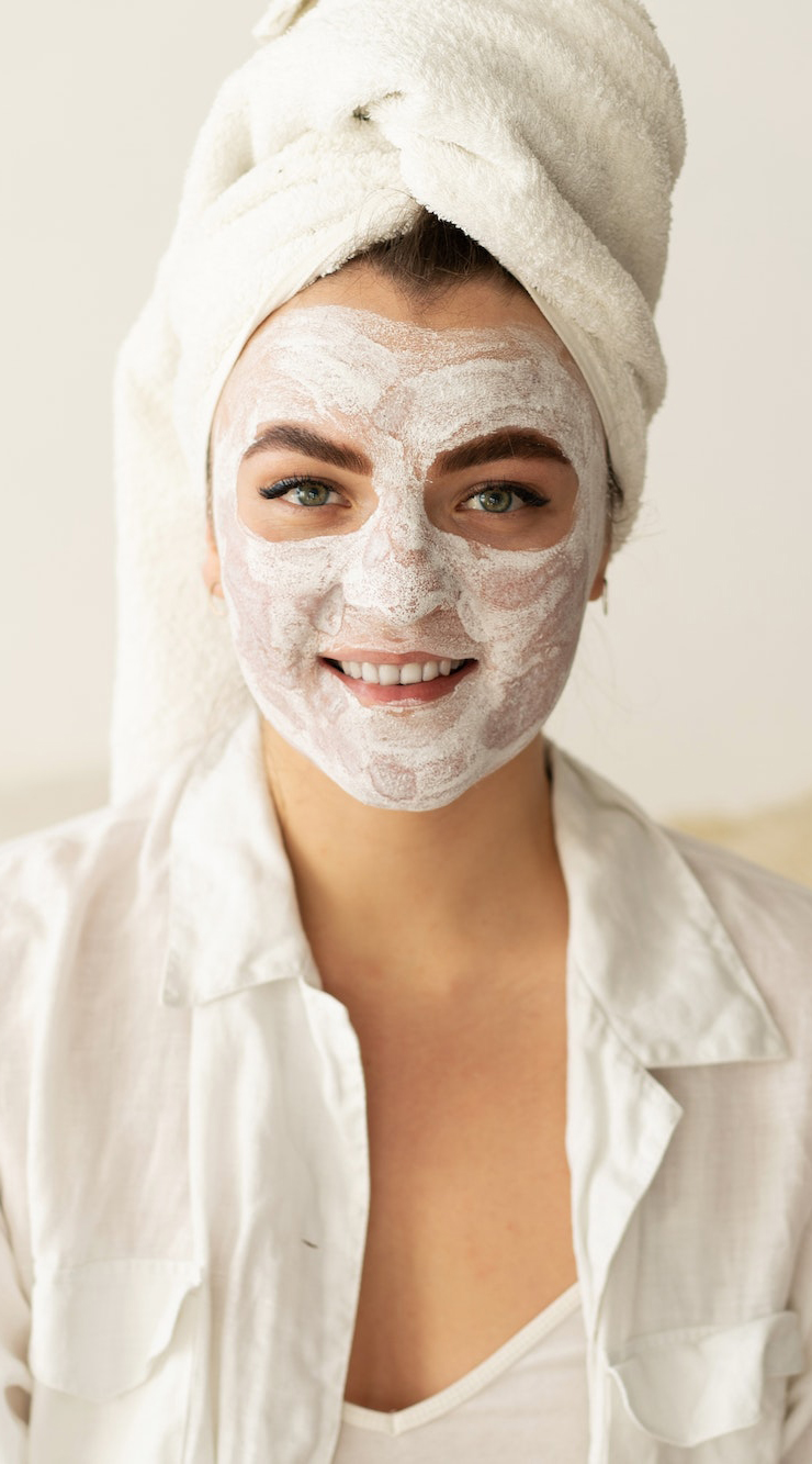beautiful-woman-applying-facial-mask